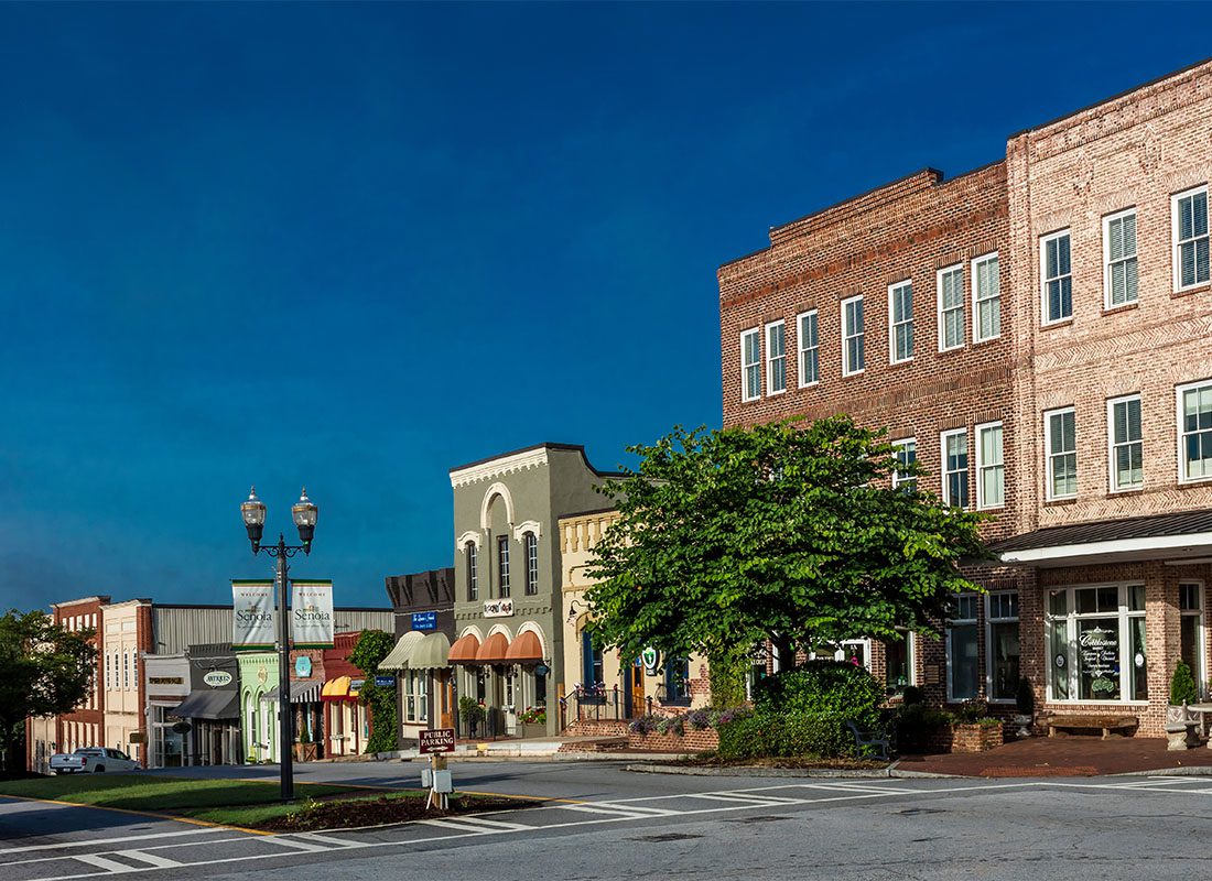 Tallapoosa, GA - Row of Small Commercial Businesses Along the Main Street in Downtown Tallapoosa Georgia Against a Dark Blue Sky